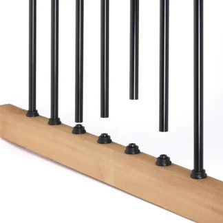 Row of black round aluminum balusters with flat base connectors installed on a wood bottom rail